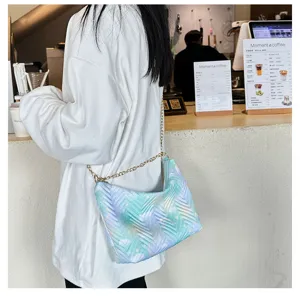 Detailed view of a trendy gradient nylon shoulder bag with a stylish chain strap for women.