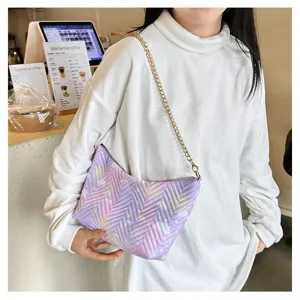Detailed view of the stylish quilted purple gradient shoulder bag featuring golden chain.