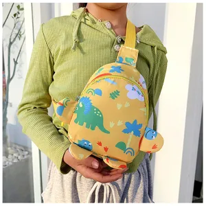 Cute cartoon dinosaur kids crossbody chest bag close-up detail showcasing vibrant yellow design.