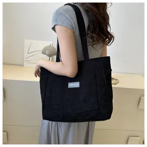 Black corduroy tote bag for women, large capacity casual shoulder handbag with front pocket.