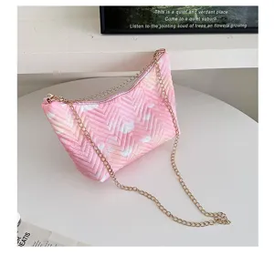Pink quilted shoulder bag with gold chain, stylish minimalist nylon underarm handbag.