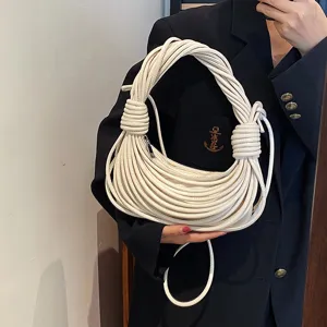 White handmade knotted noodle shoulder bag for women, niche design PU leather stylish handbag.