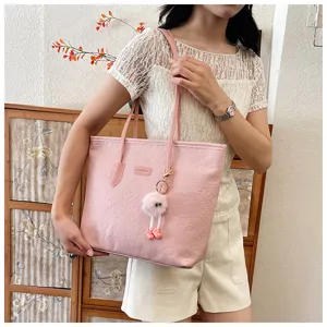 Pink large capacity tote bag for women, embossed PU leather shoulder bag with fluffy charm.