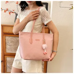 Pink embossed large capacity tote bag for women, stylish shoulder bag for daily commuting.