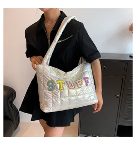 Silver quilted puffer shoulder bag with STUFF embroidery, trendy large capacity tote for women.