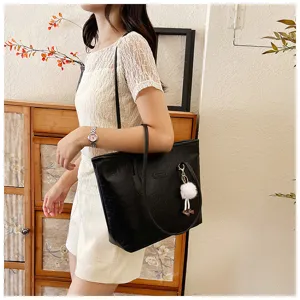 Black embossed large capacity tote shoulder bag with cute white fluffy pom-pom pendant.