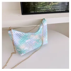 Quilted gradient underarm shoulder bag with golden chain strap, detailed view showing texture.