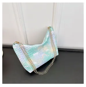 Quilted underarm shoulder bag for women, stylish gradient design with gold chain strap.