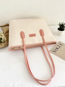 Large capacity color-block tote bag for women, embossed casual shoulder bag, commuter handbag.