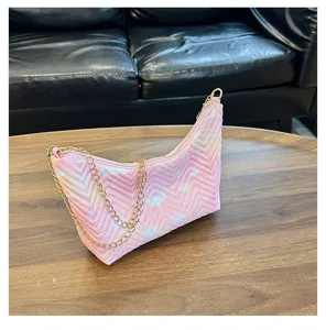 Pink quilted underarm bag detail showing soft gradient nylon fabric and stylish chain strap.