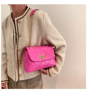 Pink quilted shoulder bag detail, stylish metal chain strap and turn lock design.