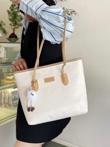 Large capacity white tote bag with embossed pattern, stylish shoulder bag for women daily commute.