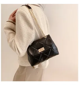 Stylish black quilted shoulder bag with gold chain strap and metal turn-lock closure.