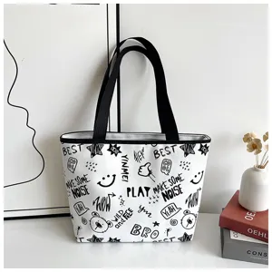 Casual black and white graffiti canvas tote bag with comfortable handles and stylish bear print.