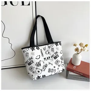 2025 autumn minimalist canvas tote bag, chic black and white graffiti print, large capacity.