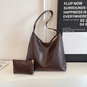 Detailed view of the stylish dark brown woven leather hobo shoulder bag with a small pouch.