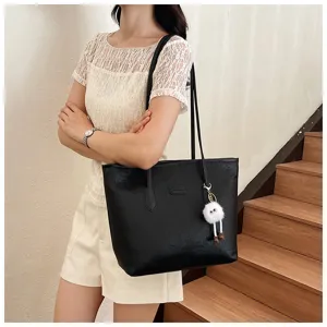 Stylish black embossed tote bag for women, large capacity shoulder bag for daily commute and casual use.