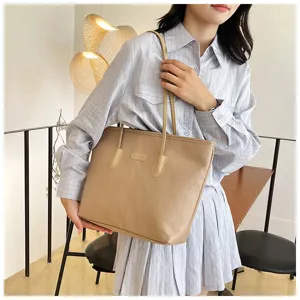 Elegant khaki embossed tote bag with double shoulder straps, spacious and stylish for daily commute.