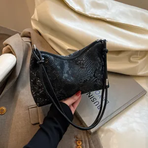 Black snake pattern underarm shoulder bag for women, stylish commute handbag with slim strap.