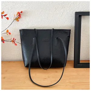 Black large capacity tote bag with embossed cartoon patterns, chic shoulder bag for commute.