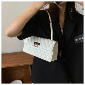 White quilted underarm bag with metal lock, elegant shoulder bag for women fashion daily wear.