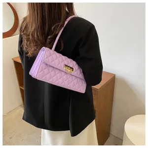 Light purple quilted shoulder bag detail, elegant diamond pattern with gold-tone lock hardware.