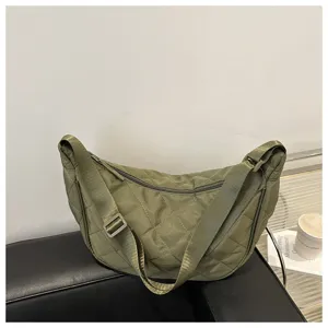 Green nylon quilted dumpling crossbody bag, casual large capacity shoulder bag detail.