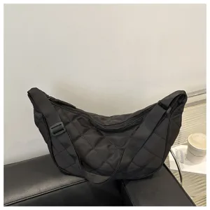 Black quilted nylon crescent crossbody bag, casual dumpling shoulder bag detail view.
