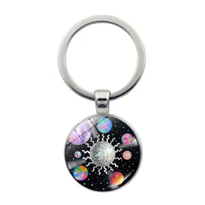 Detailed close-up of the metal keychain featuring a colorful vinyl record disco ball space art design.