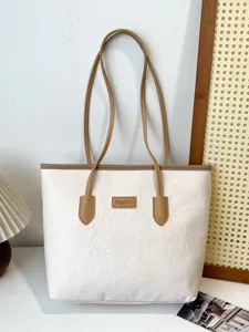 White PU leather tote bag with brown straps and embossed cute pattern for daily commute.