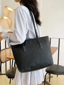 Large capacity black embossed tote bag for women, stylish commuter shoulder bag with top handles.