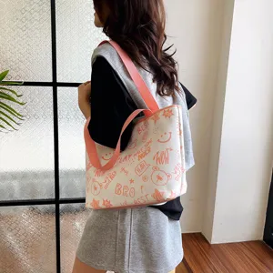 Stylish minimalist canvas tote bag for women, large capacity casual shoulder bag with prints.