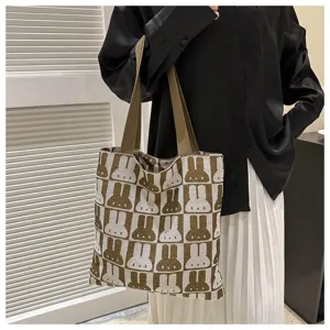 Woven tote bag for women featuring cute rabbit pattern, knit shoulder bag for daily casual use.