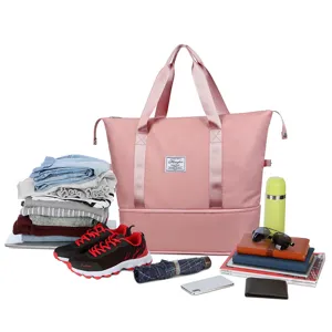 Waterproof nylon travel duffel bag with large capacity and pink color for gym and weekend trips.