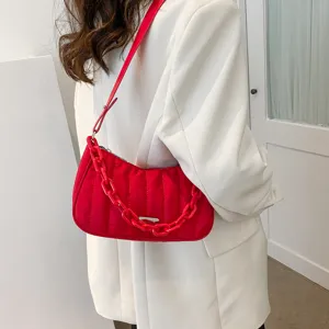 Red quilted nylon shoulder bag with chunky chain strap, stylish women's crossbody handbag.