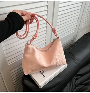 Pink snake pattern underarm shoulder bag with knot strap detail for women daily commute style