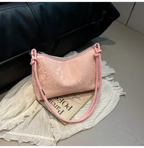 Pink textured shoulder bag detail view, elegant daily accessory for casual commute styling.
