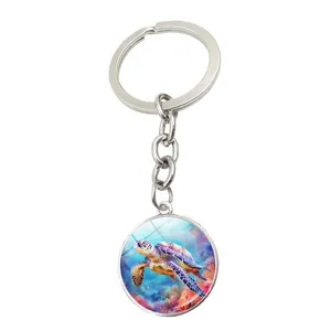 Detailed view of the sea turtle glass cabochon keychain, showcasing vibrant ocean art design.