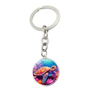Colorful sea turtle keychain with glass cabochon pendant, perfect bag charm and keyring accessory.