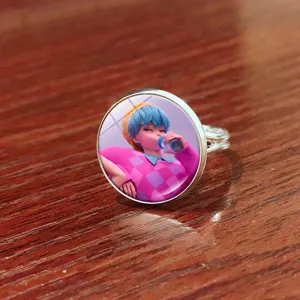 Close-up detail of the adjustable anime character ring featuring a glass dome cabochon.
