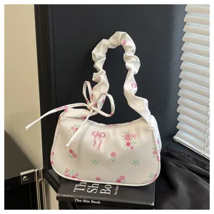 Sweet floral canvas shoulder bag with cute bow and drawstring design for stylish daily wear.