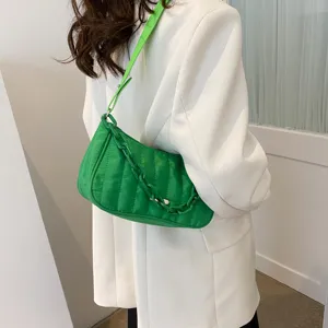 Green quilted shoulder bag detail, stylish nylon hobo handbag with chunky chain strap.