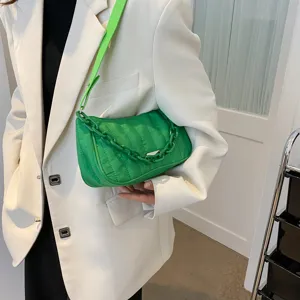 Green quilted shoulder bag with chunky chain strap, stylish nylon fabric crossbody bag.