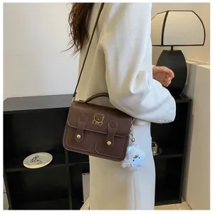 Brown PU leather vintage crossbody satchel bag with cute bear detail and plush charm.