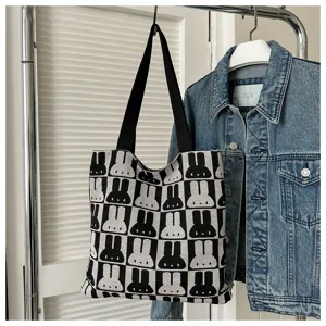 Black and white knit tote bag with cute rabbit pattern, stylish shoulder bag for women.