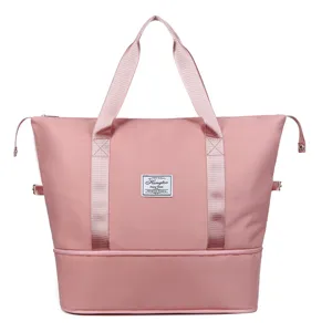 Pink foldable travel duffel bag, waterproof nylon luggage bag with large capacity.