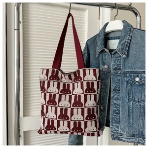 Knitted tote bag with cute rabbit pattern, large capacity woven shoulder bag for women.