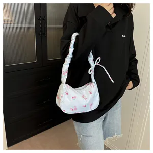 Floral bow shoulder bag detail shot, sweet canvas crossbody bag with cute scrunchie strap.