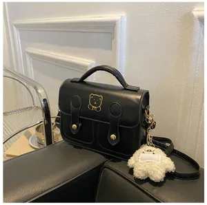 Retro PU leather mini satchel bag detail, cute bear embroidery and fluffy plush keychain.