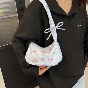 Sweet floral canvas shoulder bag for women with cute bow and drawstring design.